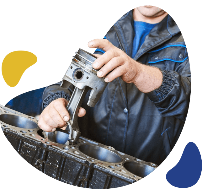 a man working on an engine with a wrench