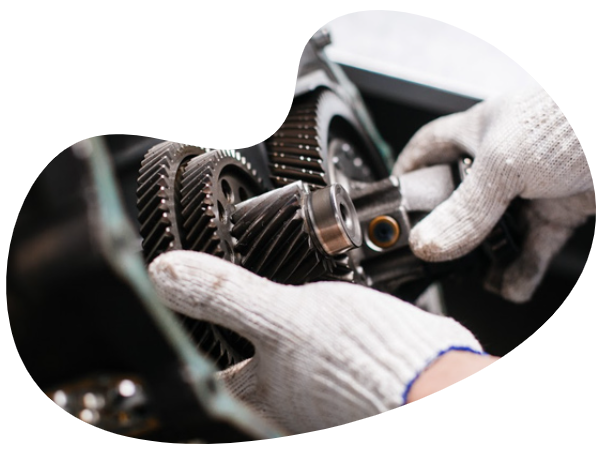 a man is working on a motorcycle engine